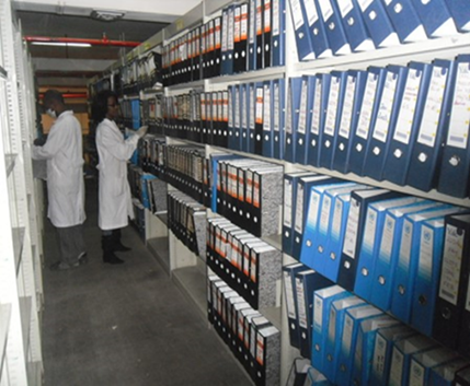 Processed records being arranged on metallic shelves