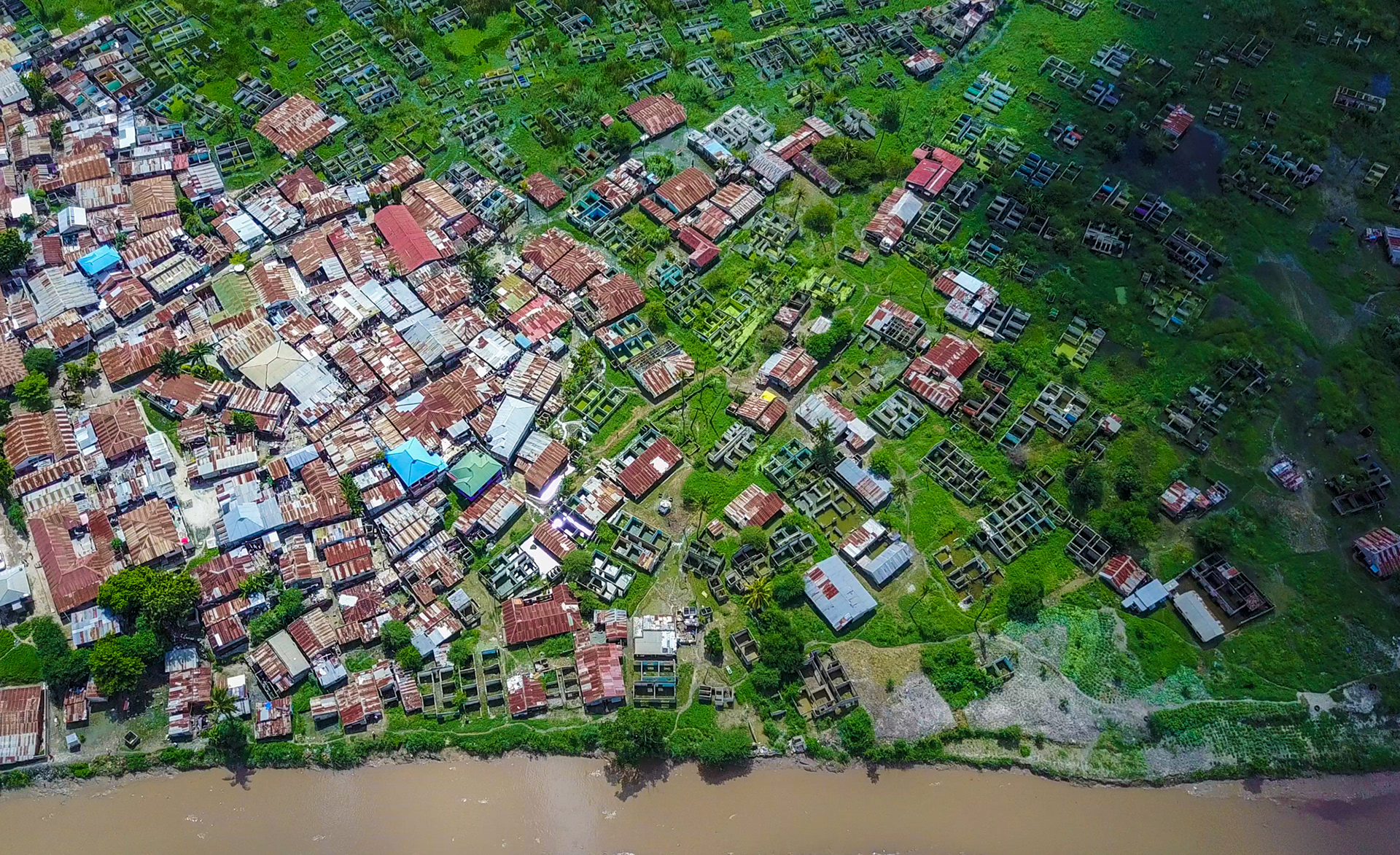 An aerial view of a flood plain of Jangwani river, which separates Masaki and Oyster Bay in Dar es Salaam, the United Republic of Tanzania. Africa is the only region with a defined land policy agenda after ECA collaborated with the African Union Commission and the African Development Bank to establish the Land Policy Initiative in 2006. Photo: UNEQUAL VIEWS