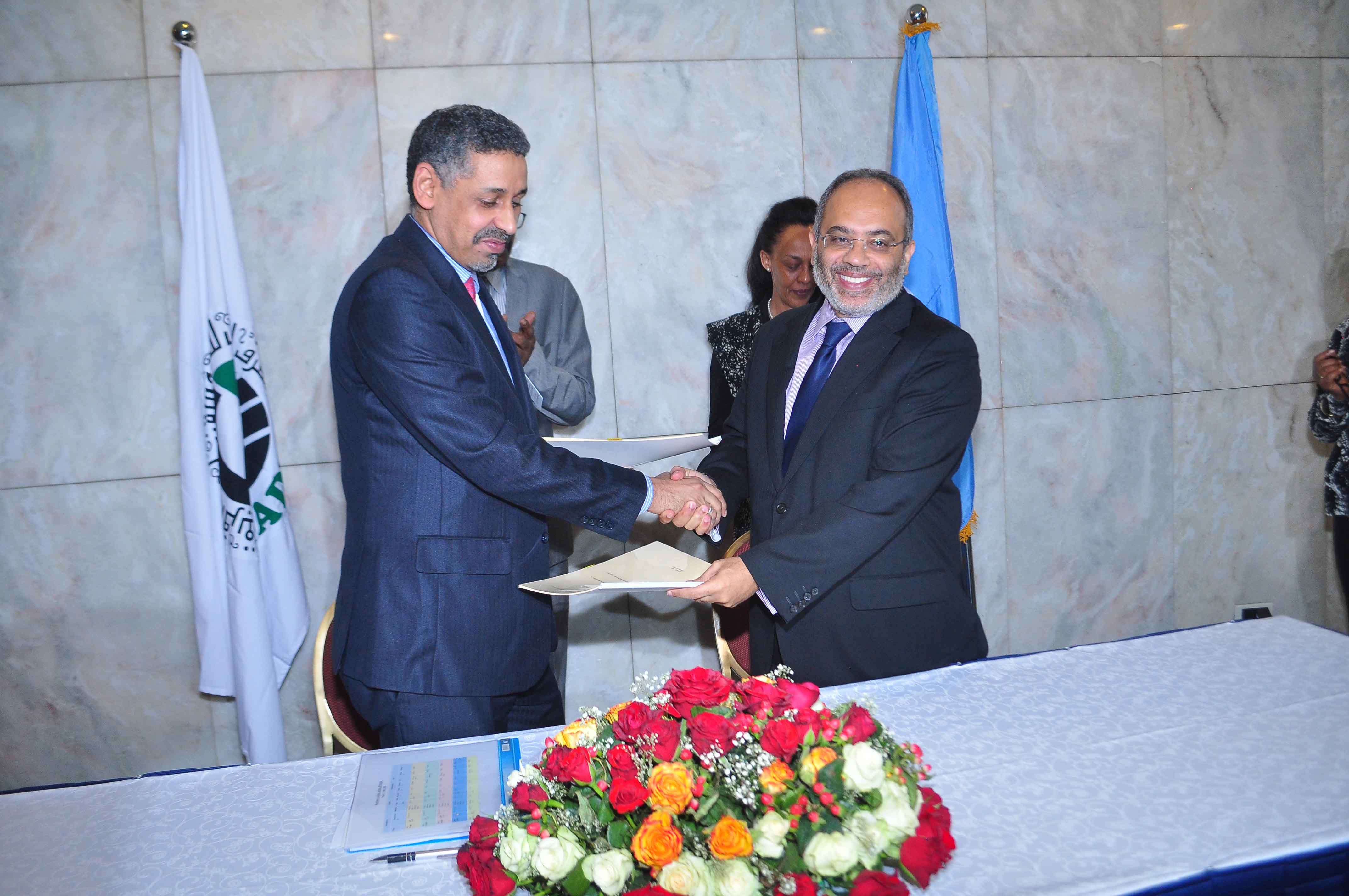 Memorandum of Understanding signing ceremony by ECA and Arab Bank for Economic Development in Africa. ECA and the Arab Bank for Economic Development in Africa (BADEA) signed a Memorandum of Understanding in Addis Ababa on 3 April 2016, on the margins of the Africa Development Week 2016. Shown are: Executive Secretary, Carlos Lopes, and the Arab Bank for Economic Development in Africa (BADEA) delegate, Director-General, Sidi Ould Tah. Photo © ECA