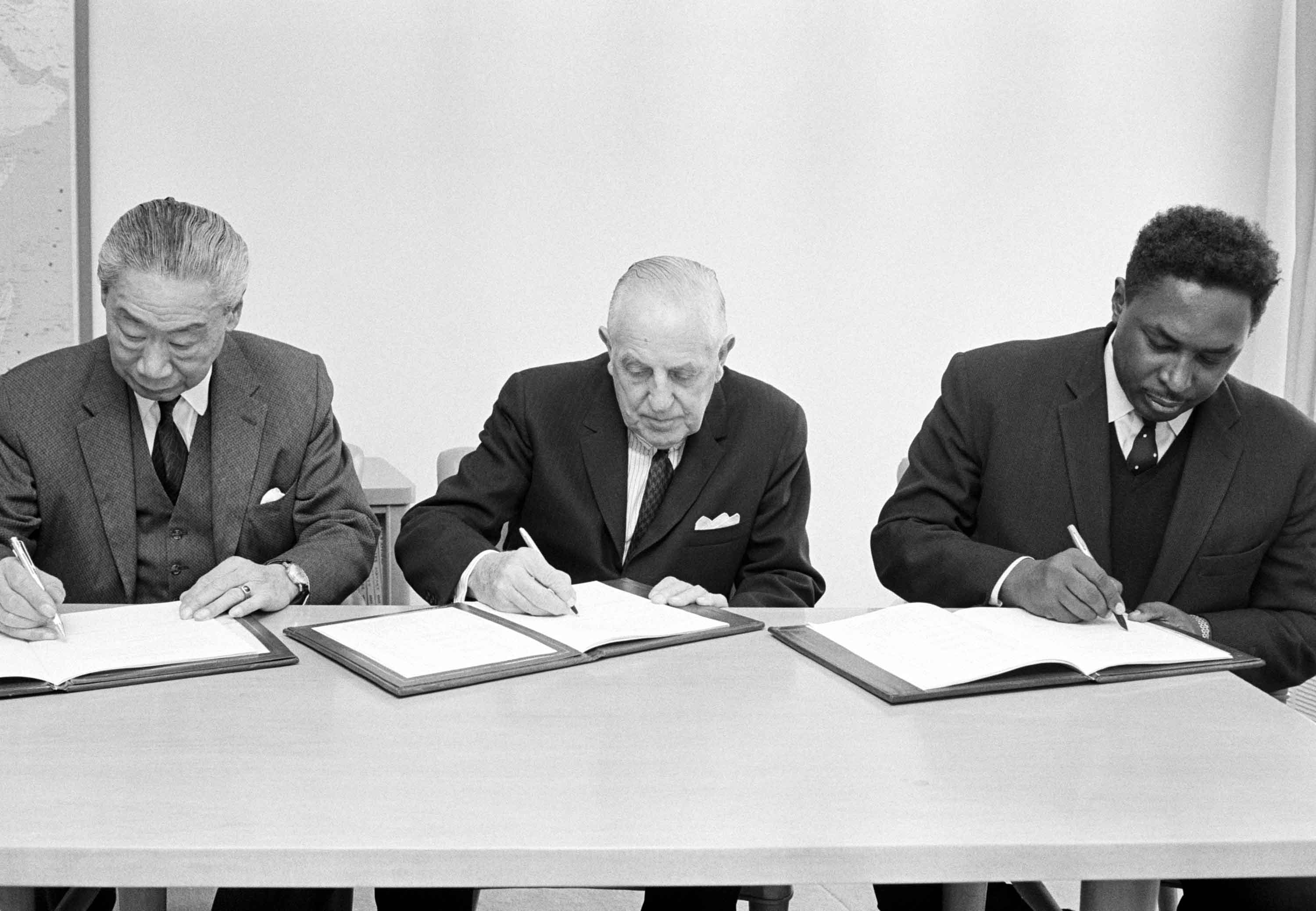 The signing of a Plan of Operation, providing for the establishment of a new investment-promoting service in the African Development Bank on 1 February 1967, by representatives of the United Nations Development Programme (UNDP), the Office of the United Nations Commissioner for Technical Cooperation and the African Development Bank. From left to right: Commissioner for Technical Cooperation, Victor Hoo; Administrator of the UNDP, Paul G. Hoffman; and President of the African Development Bank, Mamoun Beheiry of Sudan. The signing of a Plan of Operation, providing for the establishment of a new investment-promoting service in the African Development Bank on 1 February 1967, by representatives of the United Nations Development Programme (UNDP), the Office of the United Nations Commissioner for Technical Cooperation and the African Development Bank. From left to right: Commissioner for Technical Cooperation, Victor Hoo; Administrator of the UNDP, Paul G. Hoffman; and President of the African Development Bank, Mamoun Beheiry