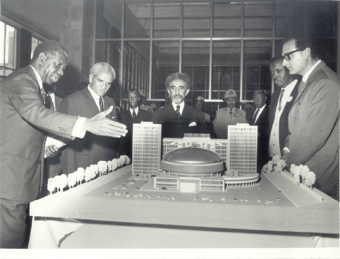 The second ECA Executive Secretary, Robert K.A Gardiner of Ghana, demonstrating the model of the ECA Building to Emperor Haile Selassie I.