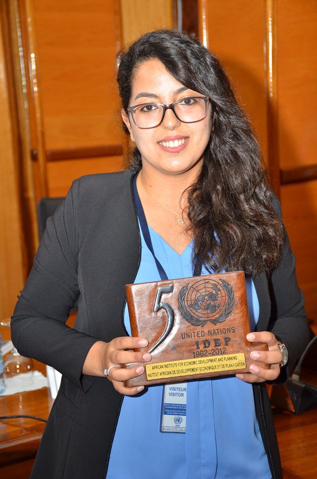 African Institute for Economic Development and Planning (IDEP) at 50 years. IDEP staff holding a plaque for the golden Jubilee. Photo © ECA