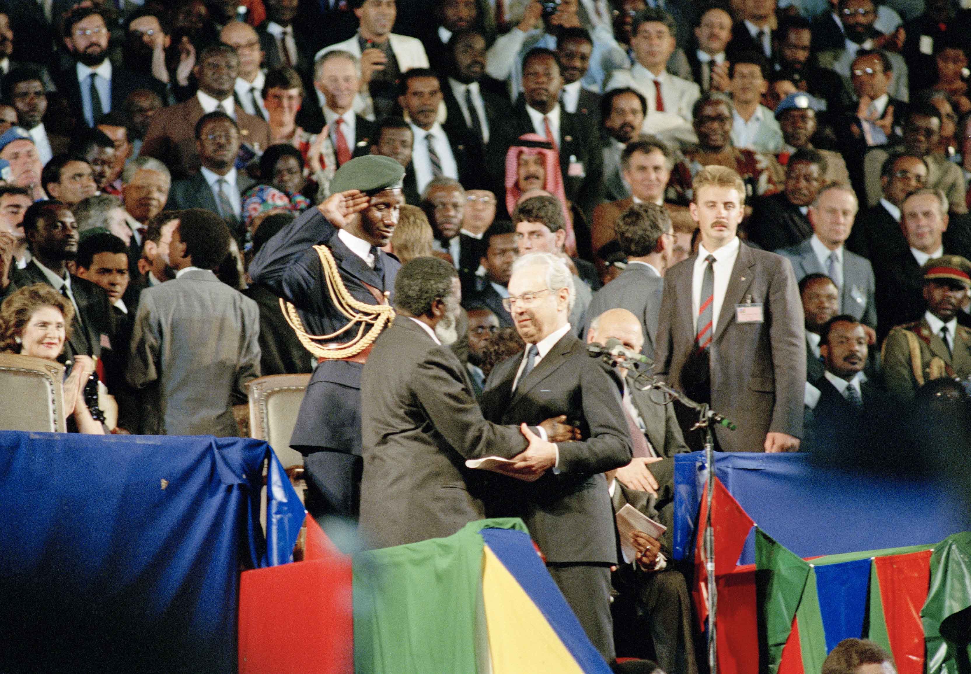 BIRTH OF A NATION: Secretary-General, Javier Perez De Cuellar (right) congratulating Sam Nujoma as the new President of Namibia, following the swearing-in ceremony on 21 March 1990. BIRTH OF A NATION: Secretary-General, Javier Perez De Cuellar (right) congratulating Sam Nujoma as the new President of Namibia, following the swearing-in ceremony on 21 March 1990.