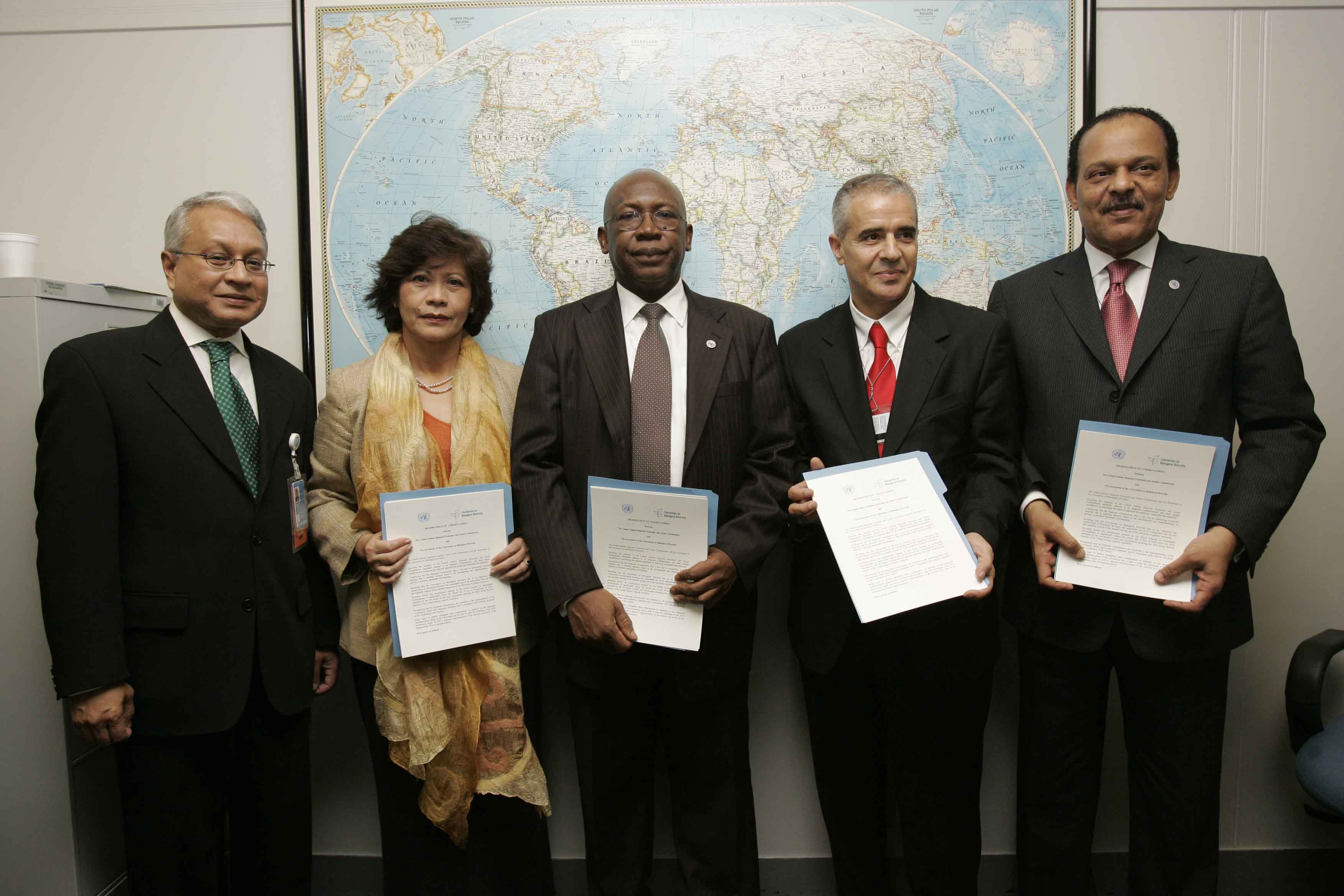 TECHNICAL COOPERATION: Former ECA Executive Secretary, Abdoulie Janneh (middle of picture) during the signing of a memorandum of understanding between ECA and the Convention on Biological Diversity, held at the United Nations Headquarters, New York, 25 October 2007. From left to right: Executive Secretary of the secretariat of the Convention on Biological Diversity, Ahmed Djoghlaf; Executive Secretary of the Economic and Social Commission for Asia and the Pacific, Noeleen Heyzer; and Executive Secretary of 
